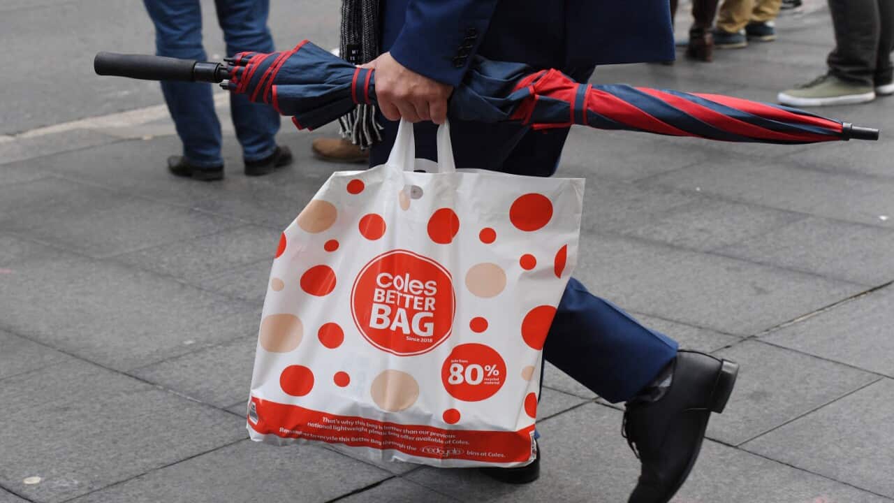 A shopper is seen carrying a reusable plastic bag at a Coles Sydney CBD store, Sydney, Monday, July 2, 2018.