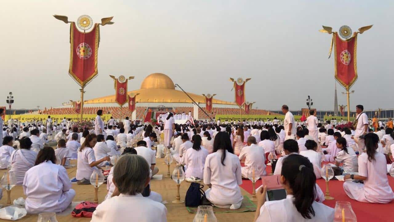 Dhammakaya devotees sat in the Grand Meditation Stadium at Wat Phra Dhammakaya.