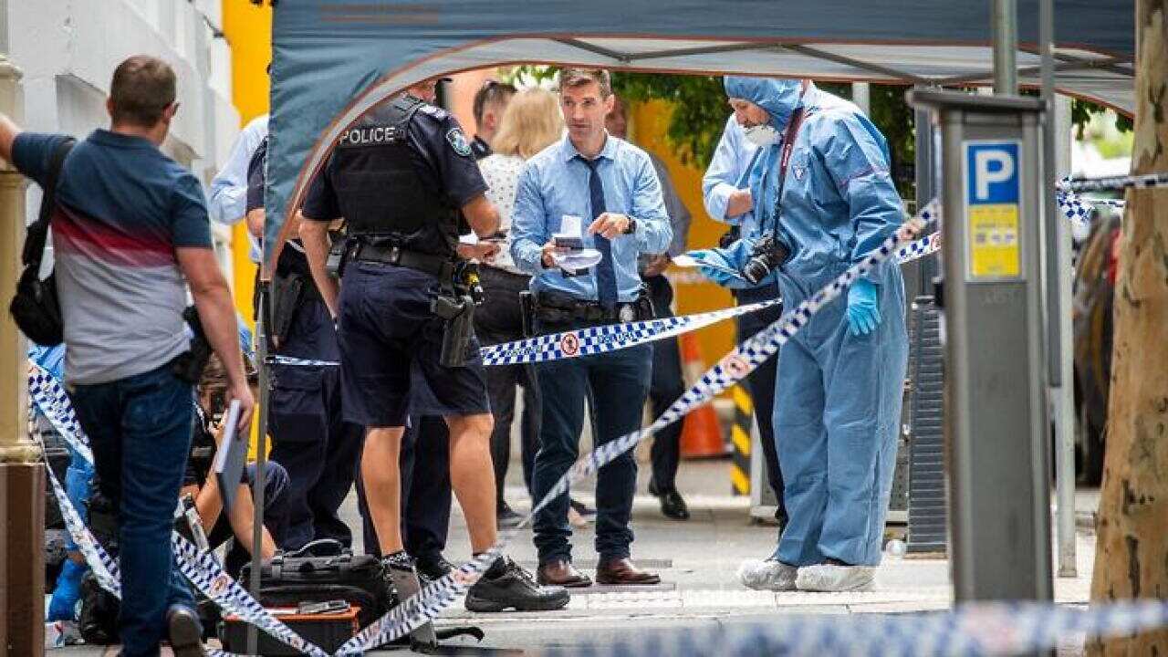 The forensic scene where police shot and killed a man outside the Westin Hotel on Mary Street in central Brisbane.