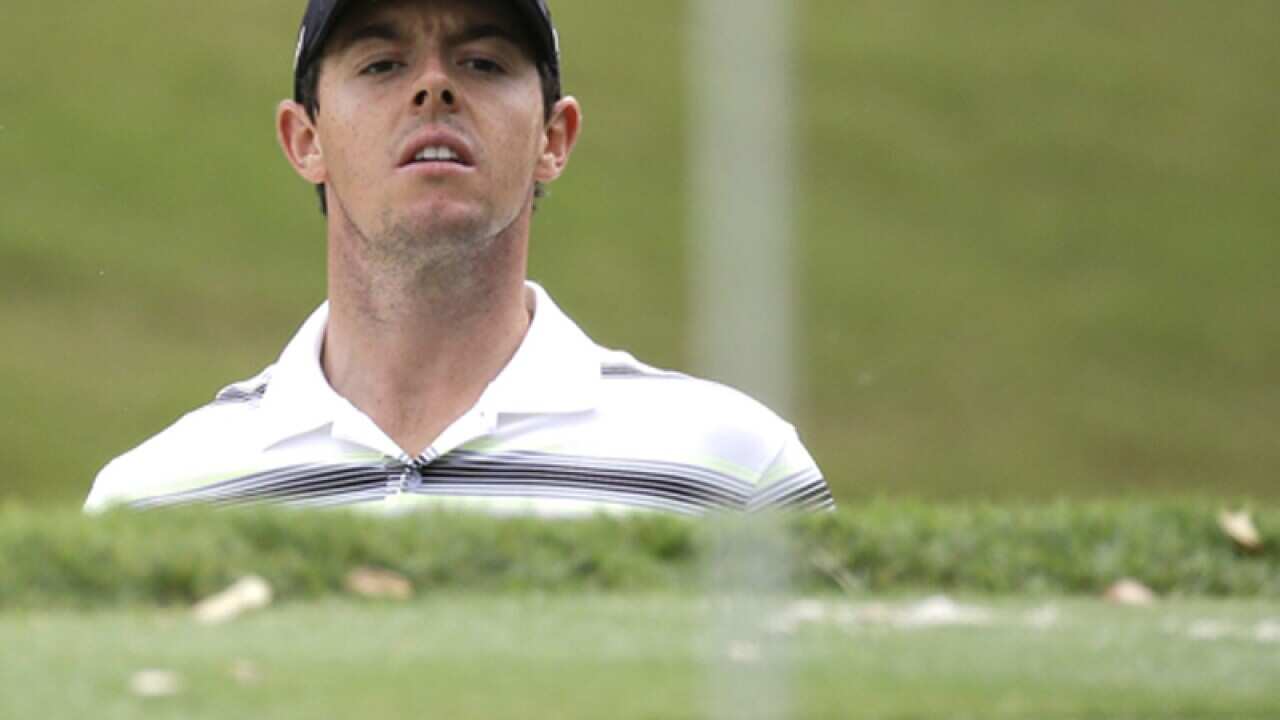 Rory McIlroy watches a chip shot