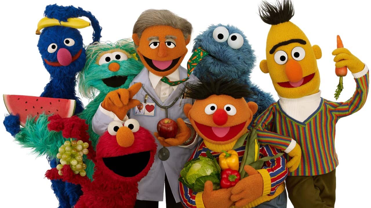 Muppet Dr. Ruster, center, with, from left, Grover, Rosita, Elmo, Cookie Monster, Ernie and Bert. (AP Photo/Sesame Workshop, John Barrett)