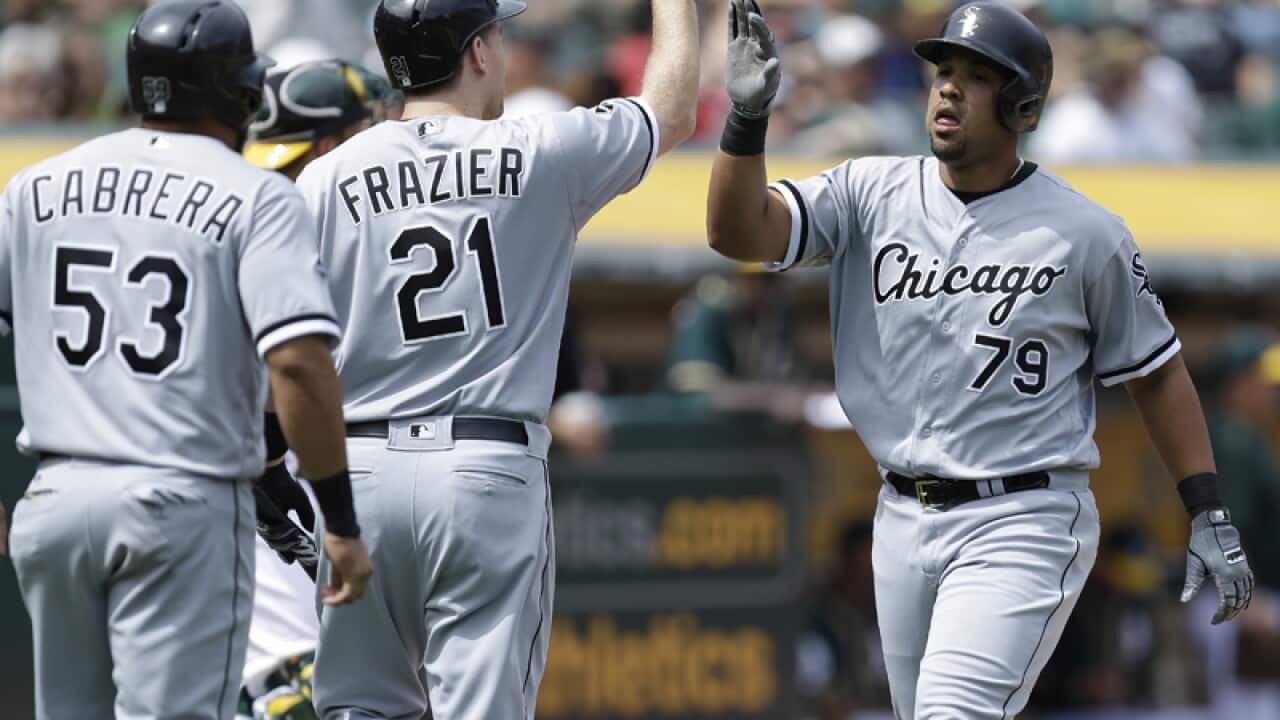 Chicago White Sox player Jose Abreu (R)