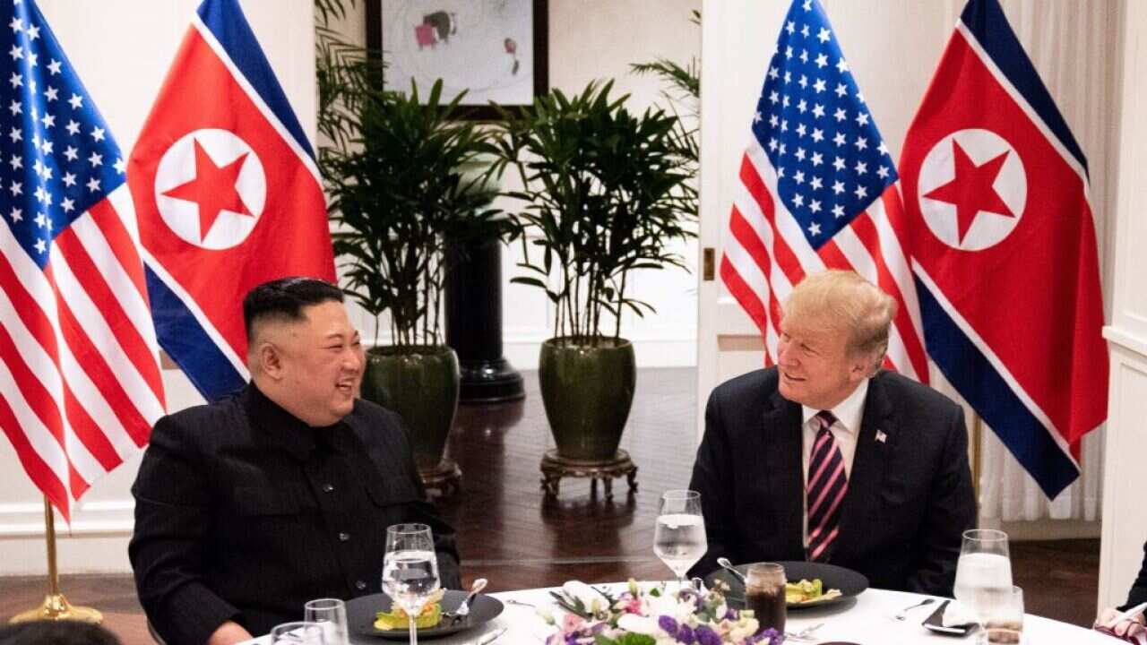 Kim Jong-un sits down at dinner with Donald Trump at the Hanoi summit