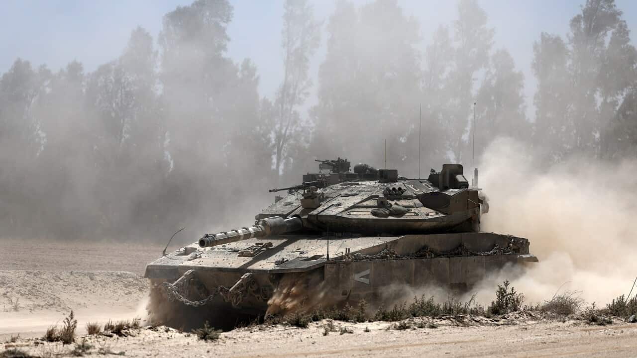 Israeli troops gather at the borded with southern Gaza