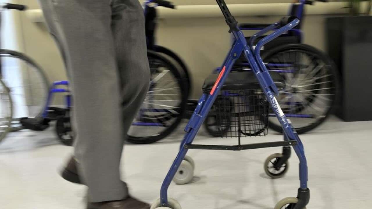 A man uses a walker to assist his mobility