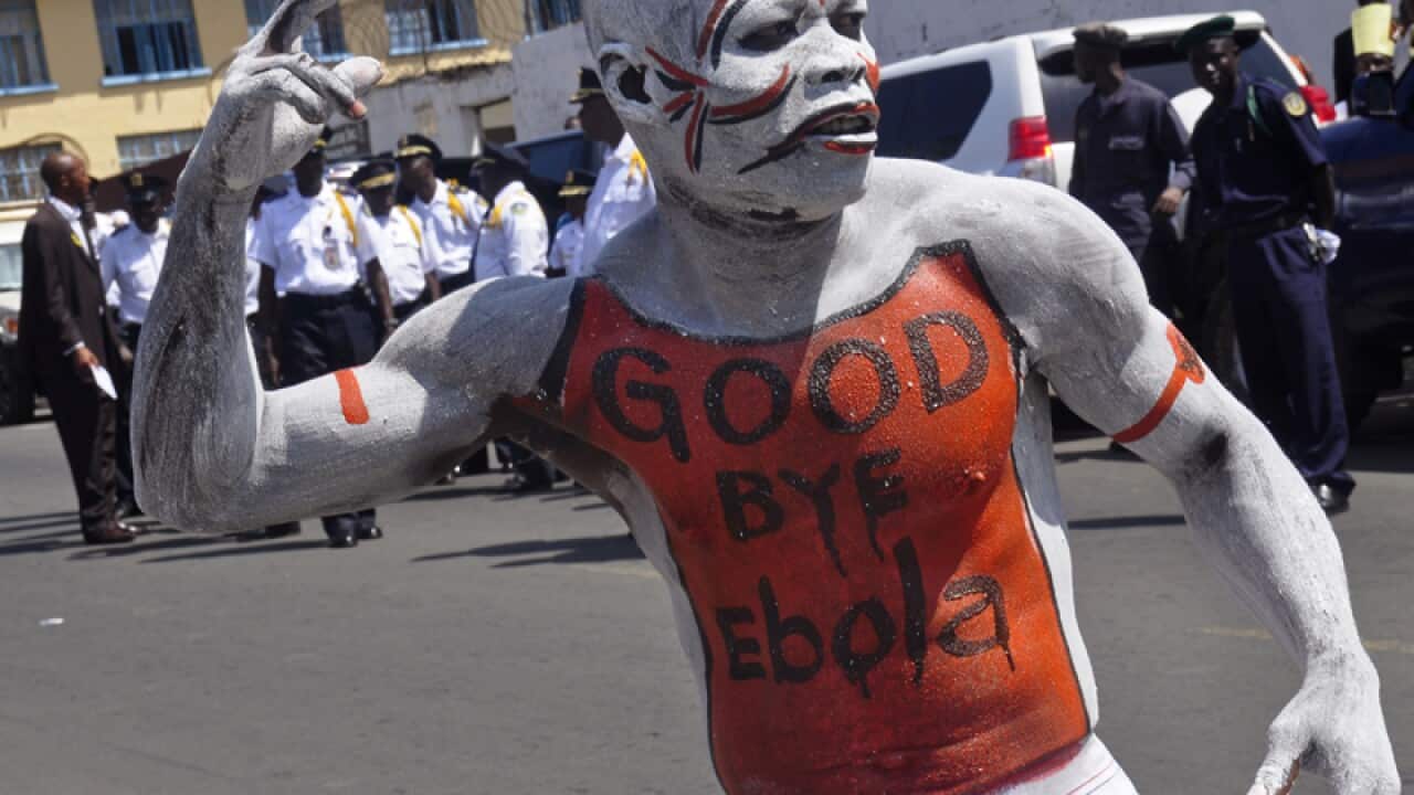 A man takes part in the celebrations, to mark Ebola free nation