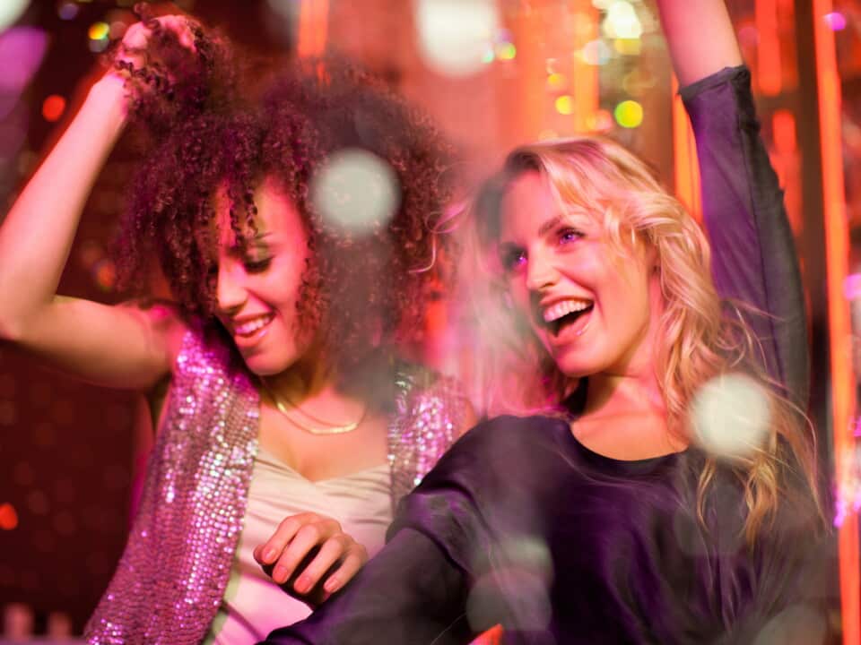 Friends dancing in nightclub