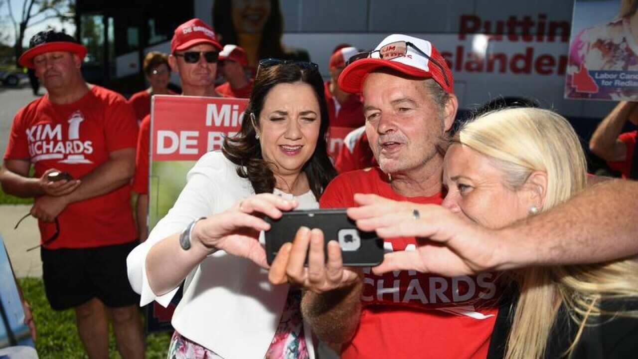 Annastacia Palaszczuk (centre) and Labor candidate Kim Richards.
