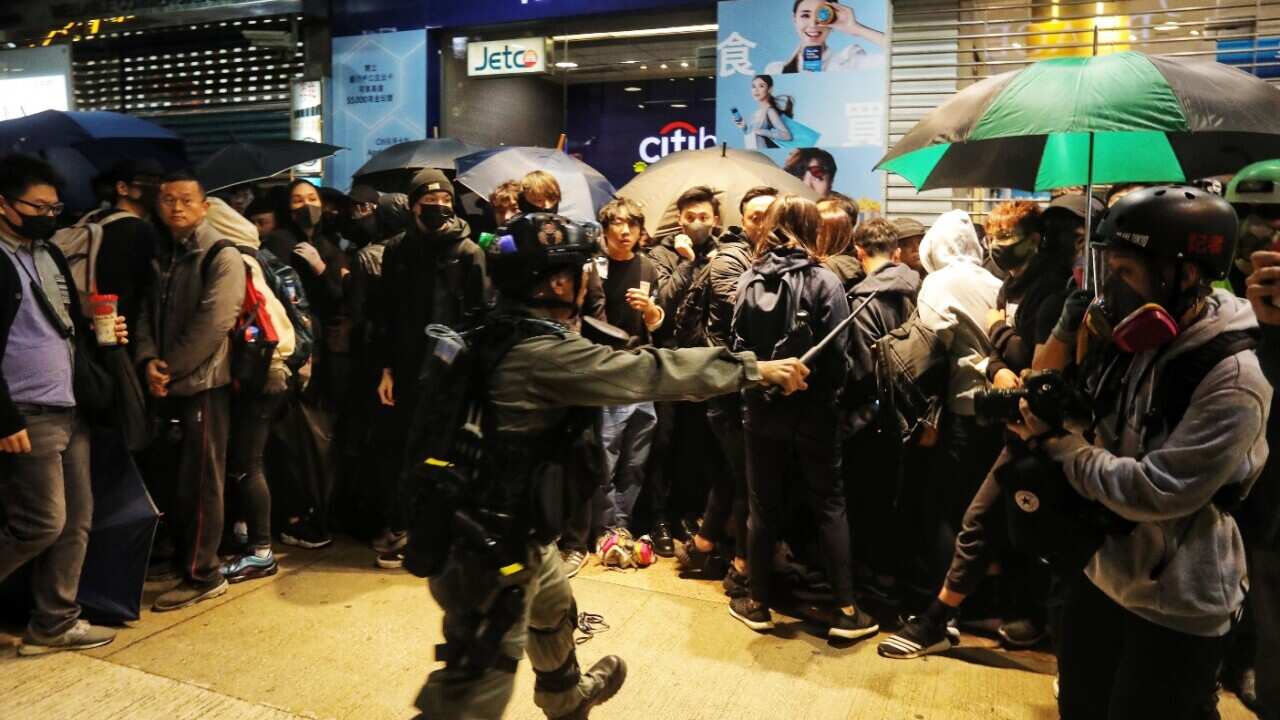 Riot police detain protesters during an anti-government rally on New Year's Day in Hong Kong.