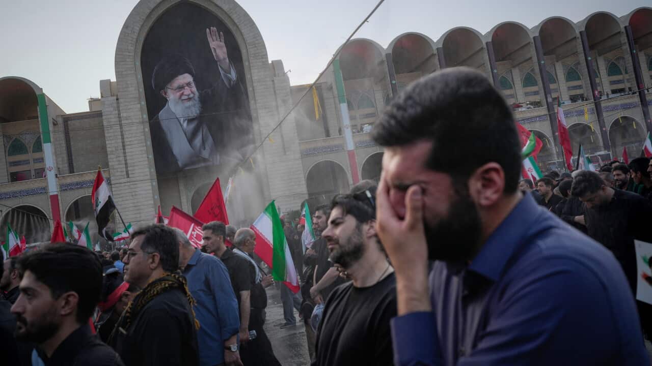 A mourner weeps during the funeral ceremonies for slain Iranian Supreme Leader Ayatollah Ali Khamenei and members of his family at the Imam Khomeini Mosalla Grand Mosque in Tehran, Iran, Saturday, July 4, 2026