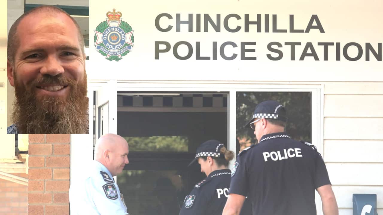 A digital image. The main photo shows three officers walking through the door of a police station. An inset shows a man with a beard.