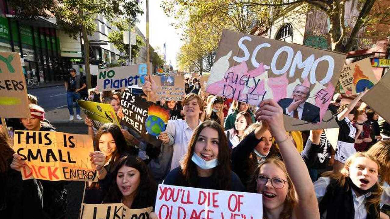 Protesters are seen during School Strike 4 Life protest, in Melbourne, Friday, May 21, 2021. Students across the country are striking in the name of climate action, calling on the federal government to stop using taxpayer money for fossil fuels.