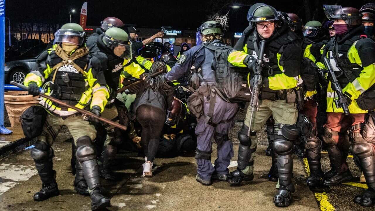 Police Officers make arrests at the Pump N' Munch Gas Station near the Brooklyn Center Police Department on April 12, 2021 in Brooklyn Center