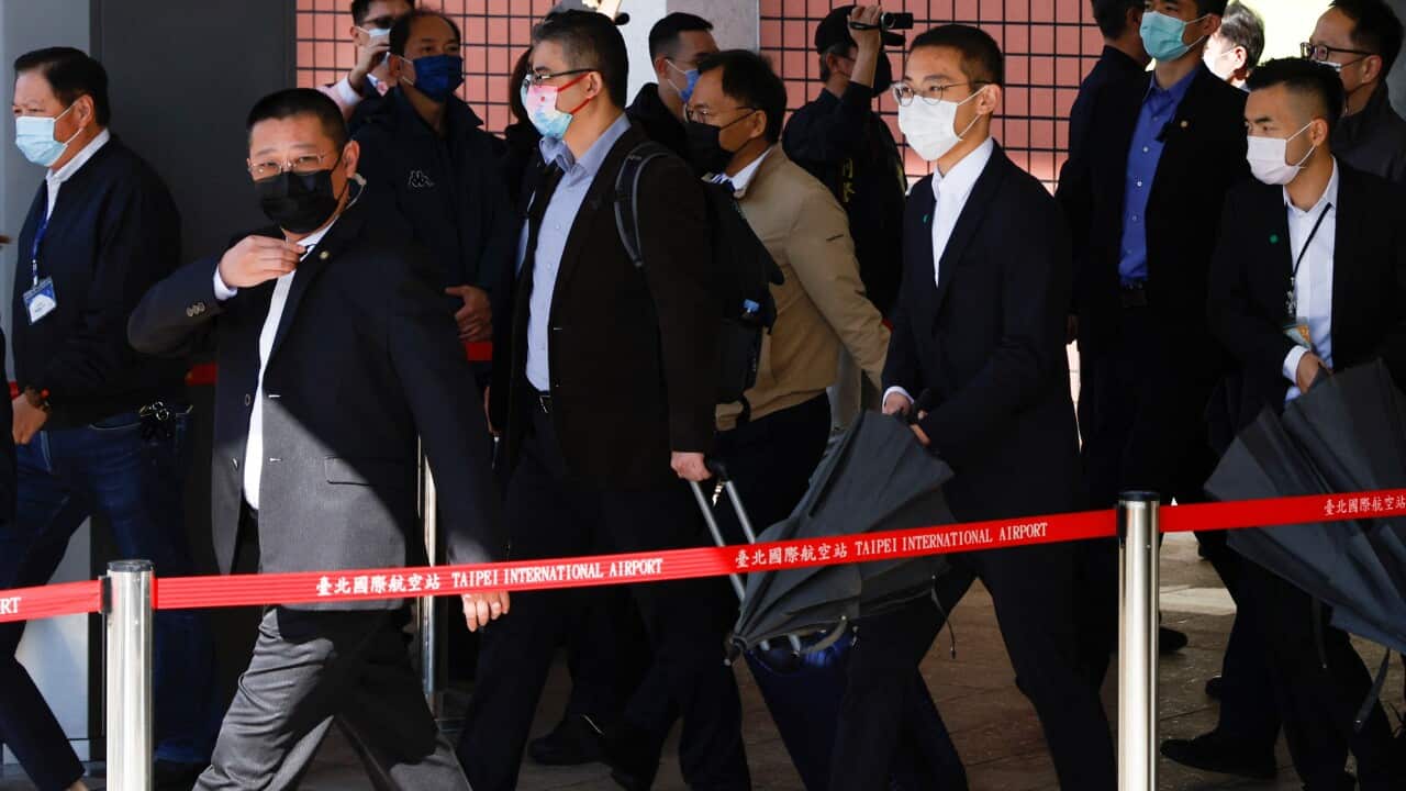 Liu Xiaodong, head of the delegation of Chinese officials visiting Taiwan, walks out of the arrival hall at at Taipei Songshan Airport in Taipei
