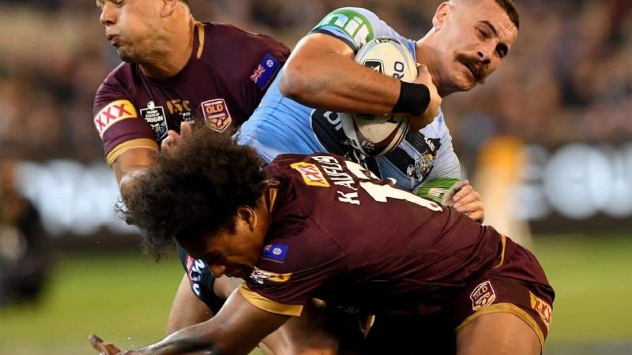 Reagan Campbell-Gillard of the Blues is tackled