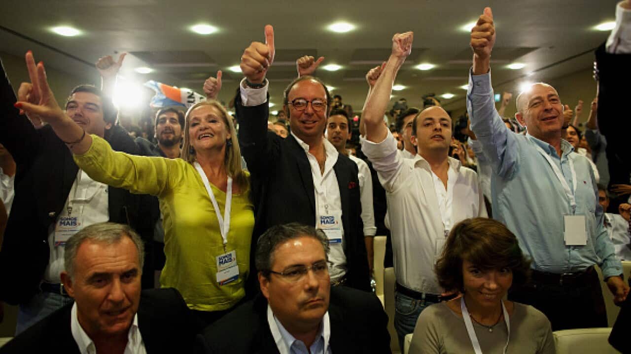 Supporters of Pedro Passos Coelho's coalition 'Portugal a frente' (Forward Portugal) react as they learn the first tv polls estimations at Sana Hotel on October 4, 2015 in Lisbon, Portugal.