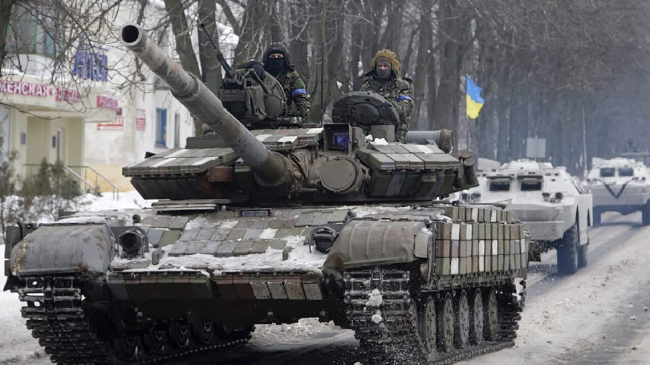 Ukrainian forces vehicles drive in Volnovakha city