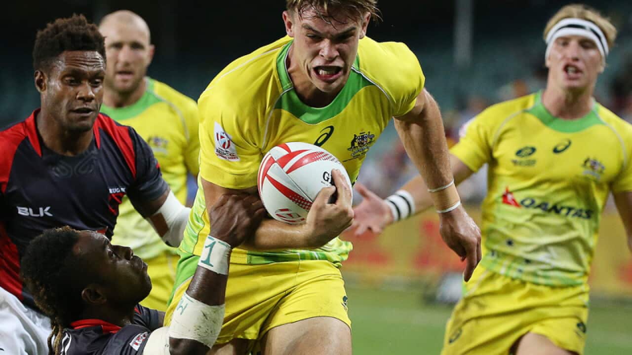 Australia's Charlie Taylor runs with the ball