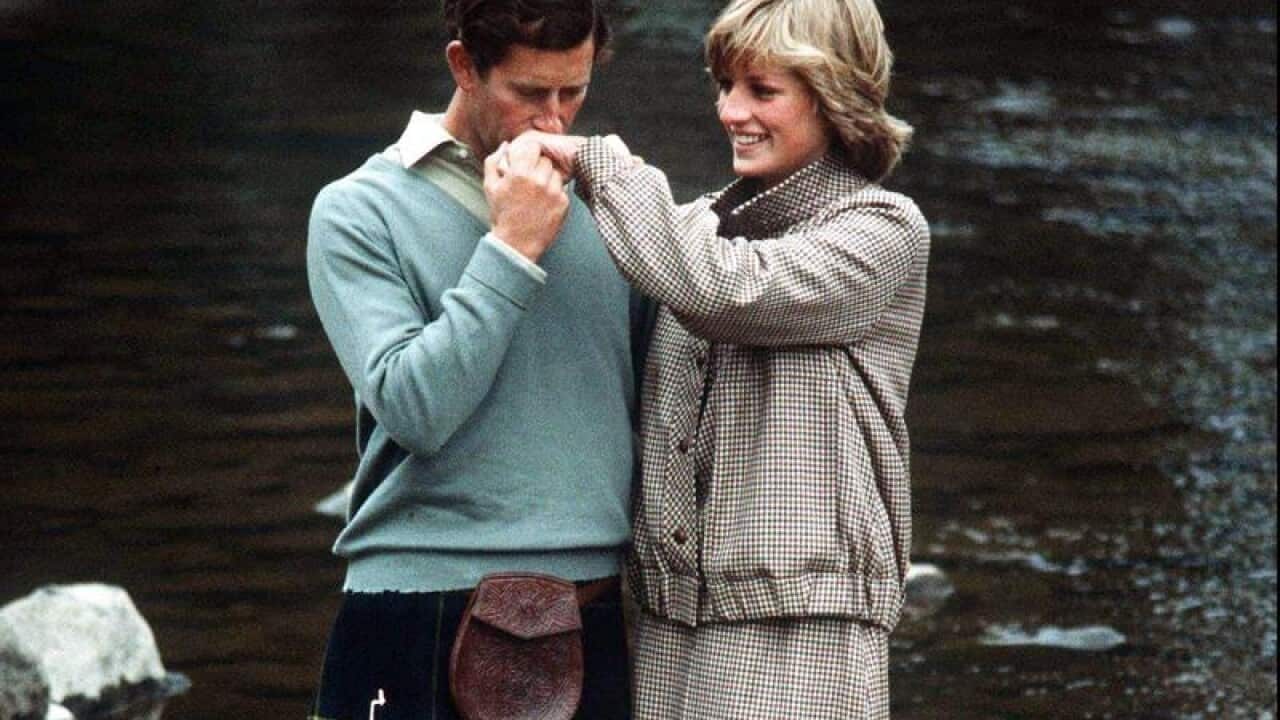 Prince Charles, Prince of Wales kisses Diana,