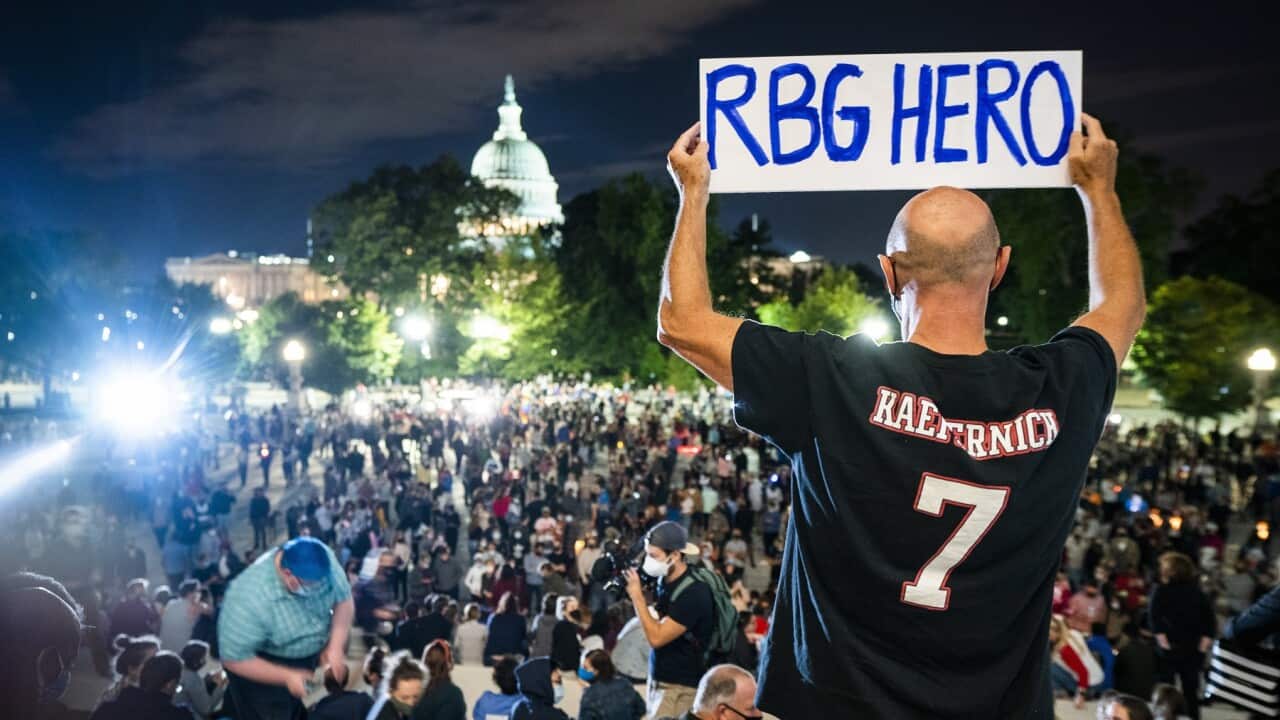 Mourners gather on the steps of the US Supreme Court after Justice Ruth Bader Ginsburg died from pancreatic cancer in Washington, DC, USA.
