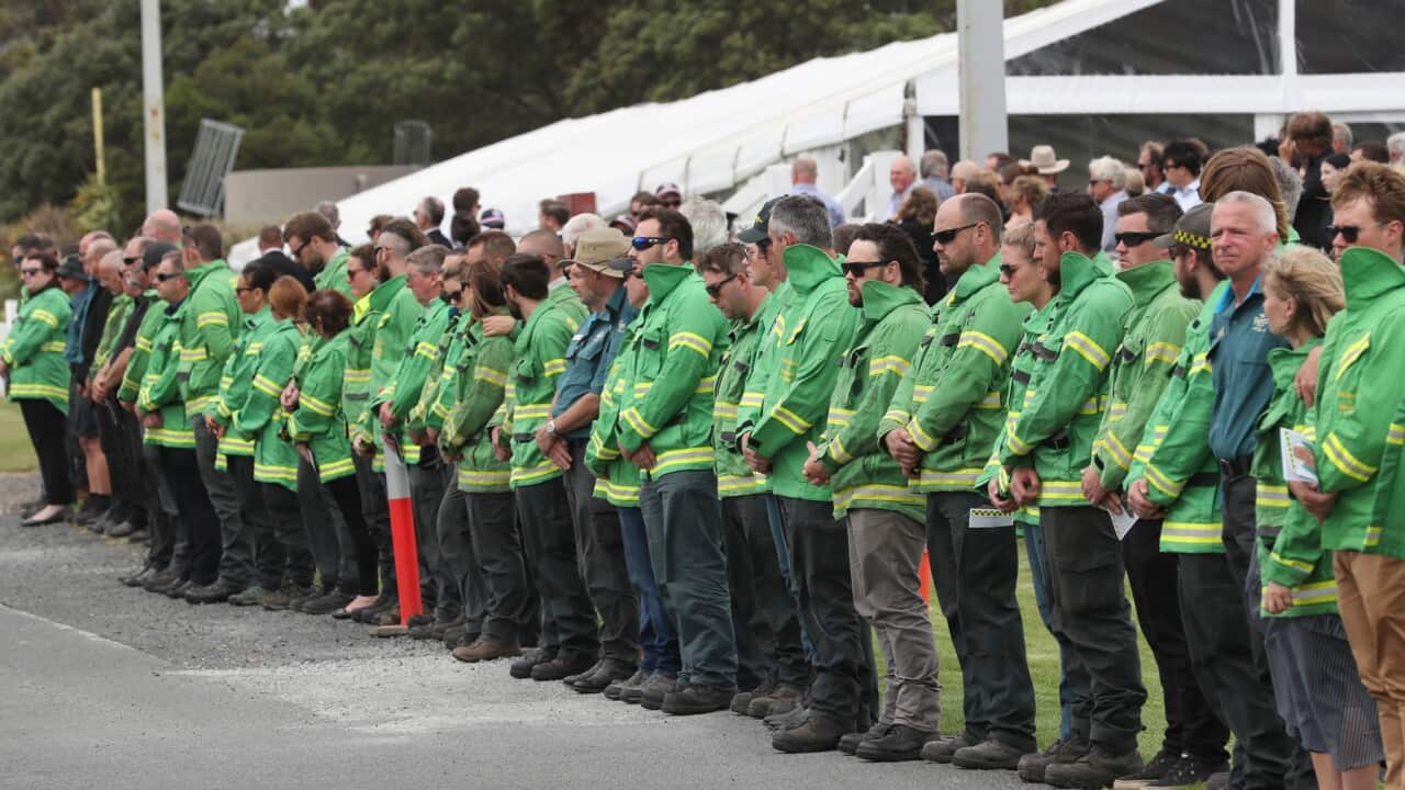 A guard of honour of Forestry and Fire Management workers at the funeral for Bill Slade at Wonthaggi