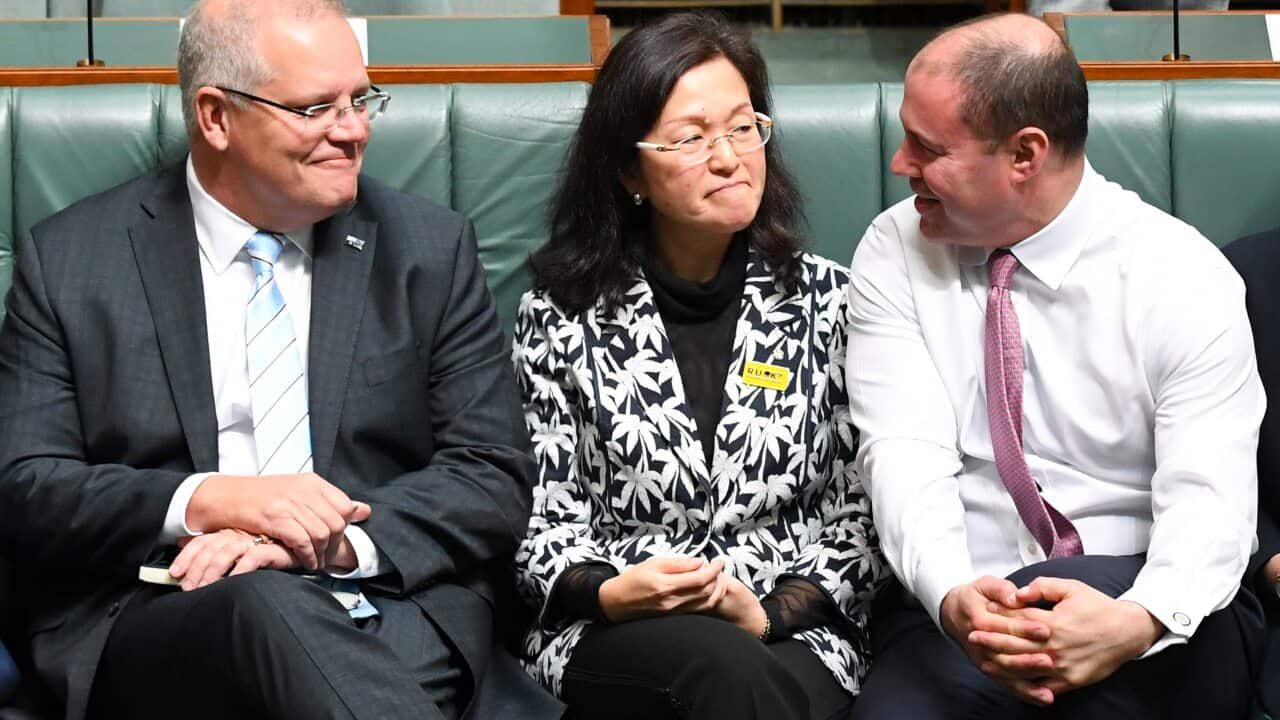 Australian Prime Minister Scott Morrison (left) and Australian Federal Treasurer Josh Frydenberg (right) sit next to Liberal member for Chisholm Gladys Liu.
