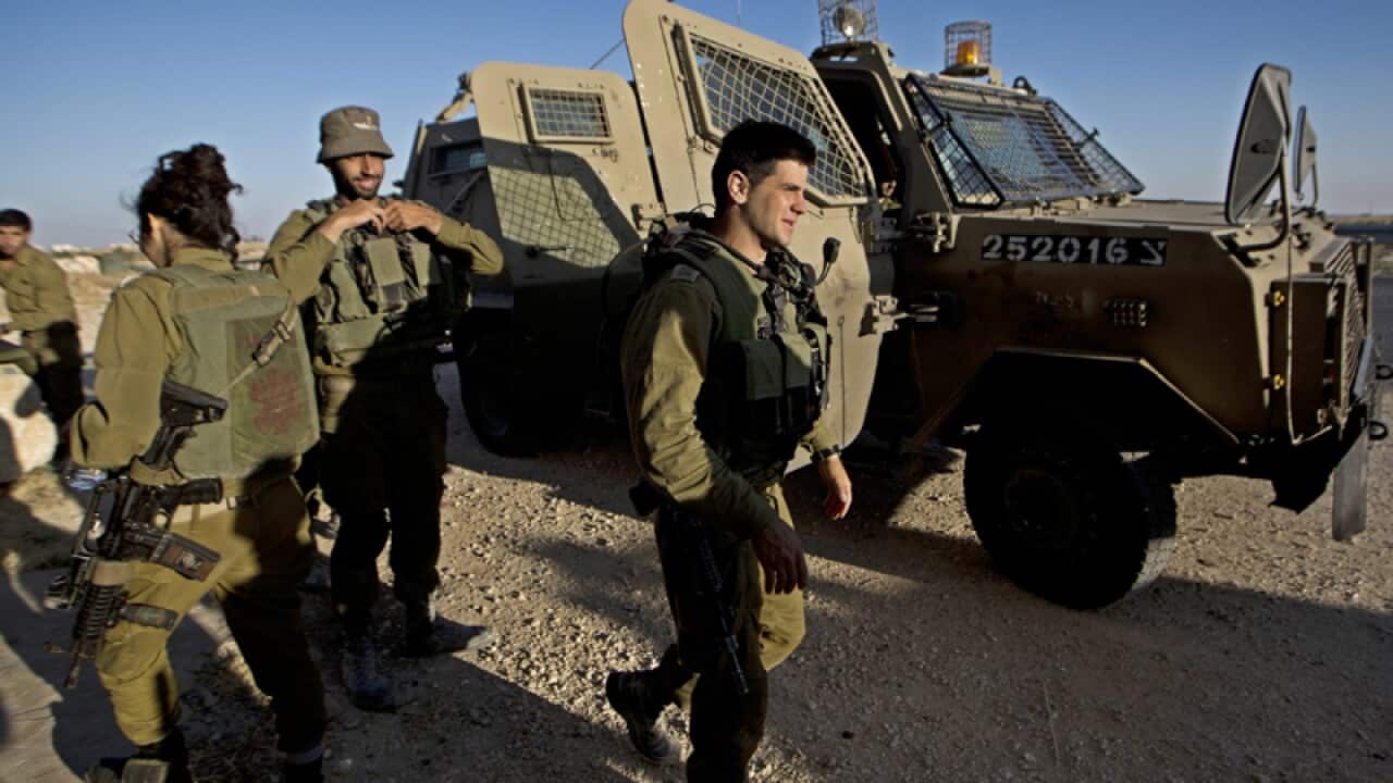Israeli soldiers search for three missing Israeli teenagers