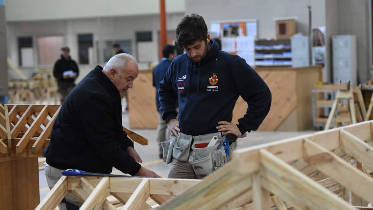 A master and apprentice carpenter are seen at Holmesglen TAFE Chadstone campus in Melbourne, Monday, May 15, 2017. (AAP Image/Julian Smith) NO ARCHIVING