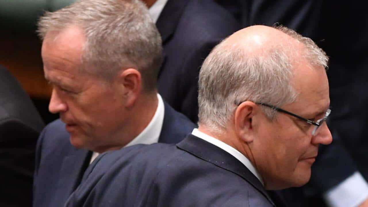 Leader of the Opposition Bill Shorten and Prime Minister Scott Morrison during division in the House of Representatives at Parliament House in Canberra, Thursday, December 6, 2018. (AAP Image/Mick Tsikas) NO ARCHIVING