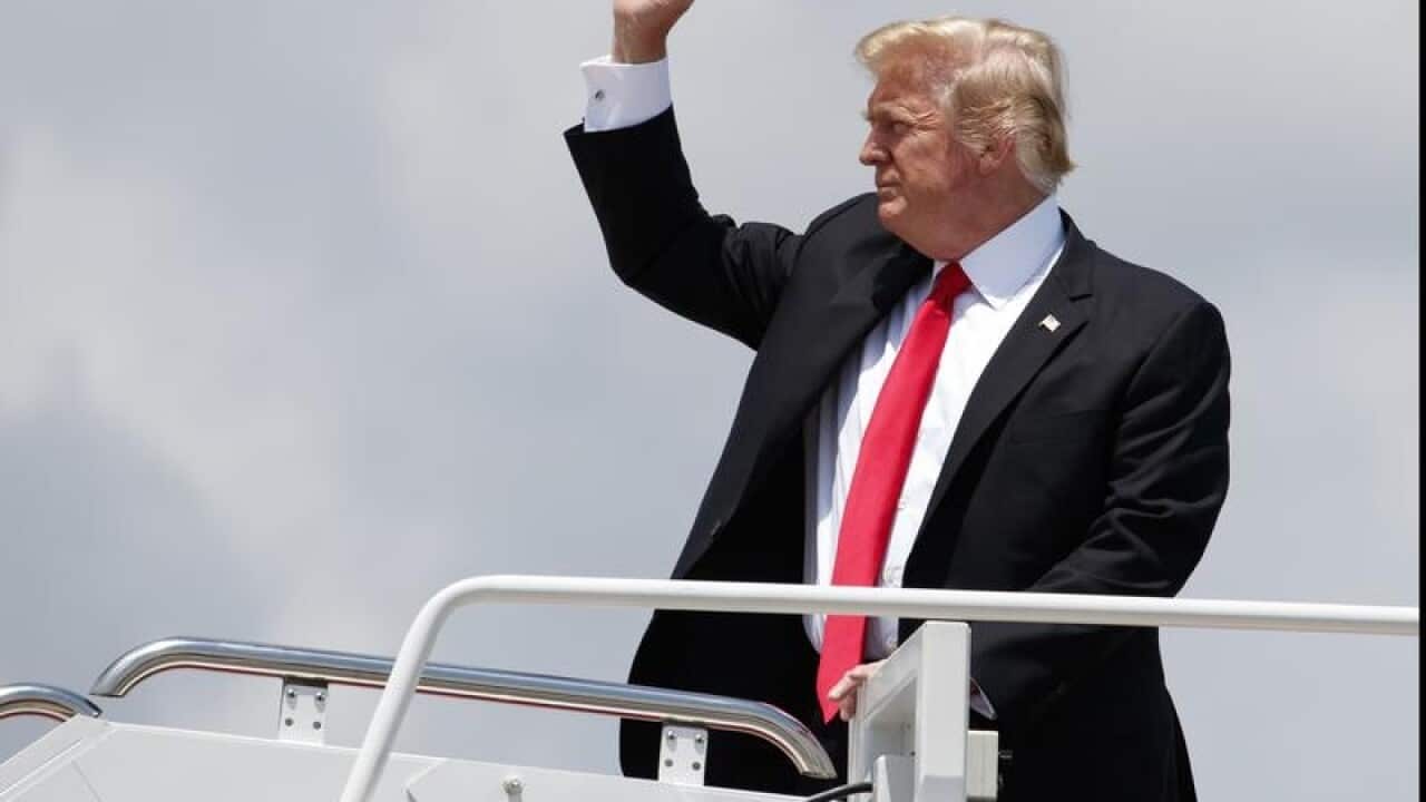 President Donald Trump boards Air Force One.