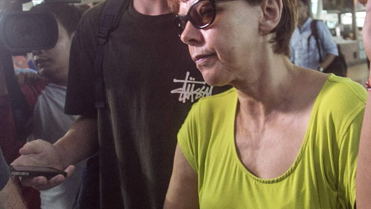 Australian teenager Jamie Murphy walks with his mother to depart to Perth at Bali International Airport, Bali, Indonesia, Thursday, Nov. 24, 2016