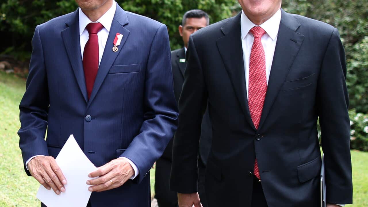 Indonesia President Joko Widodo (left) and Australian Prime Minister Malcolm Turnbull walk together after a media conference in the gardens of Kirribilli House in Sydney, Sunday, Feb. 26, 2017. (AAP Image/David Moir) NO ARCHIVING