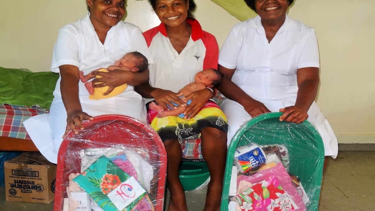 Mothers with Baby Bundles in Papua New Guinea
