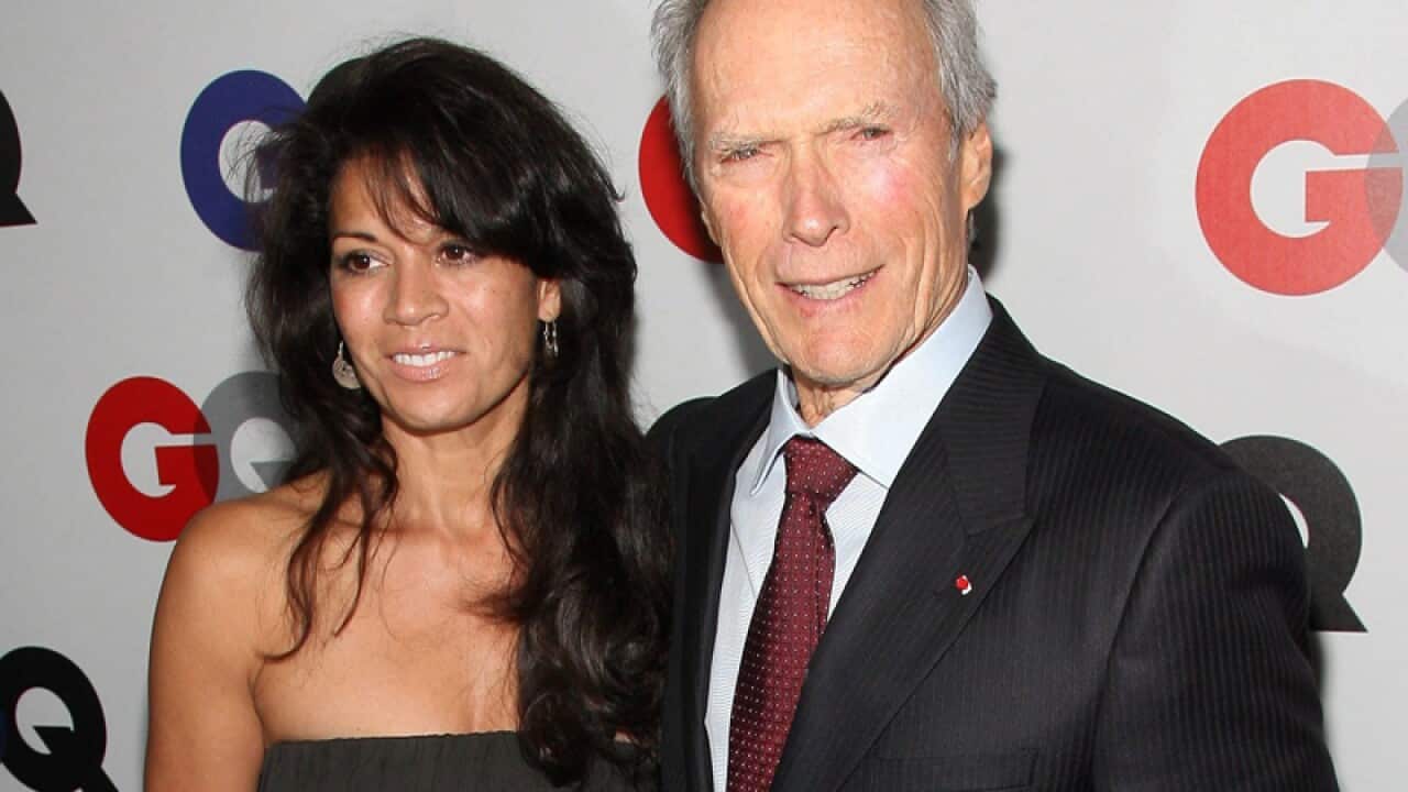 US actor Clint Eastwood (R) and his wife Dina Ruiz