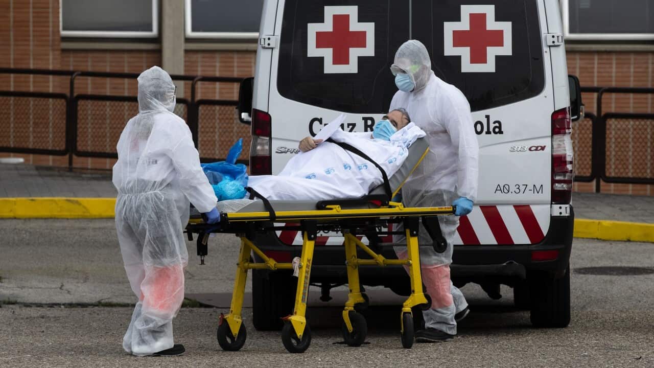 Emergency workers transport a patient at a hospital in Leganes, Spain