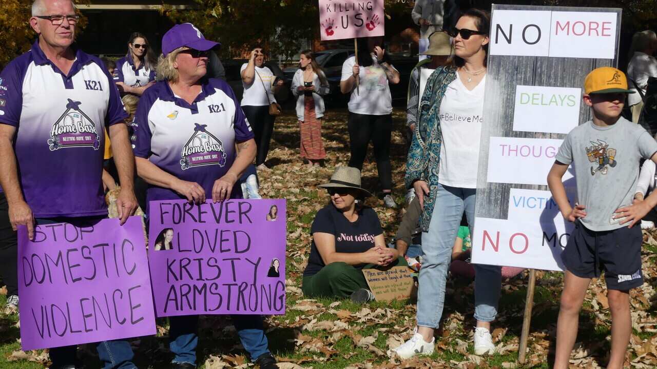 Men and women at a domestic violence rally
