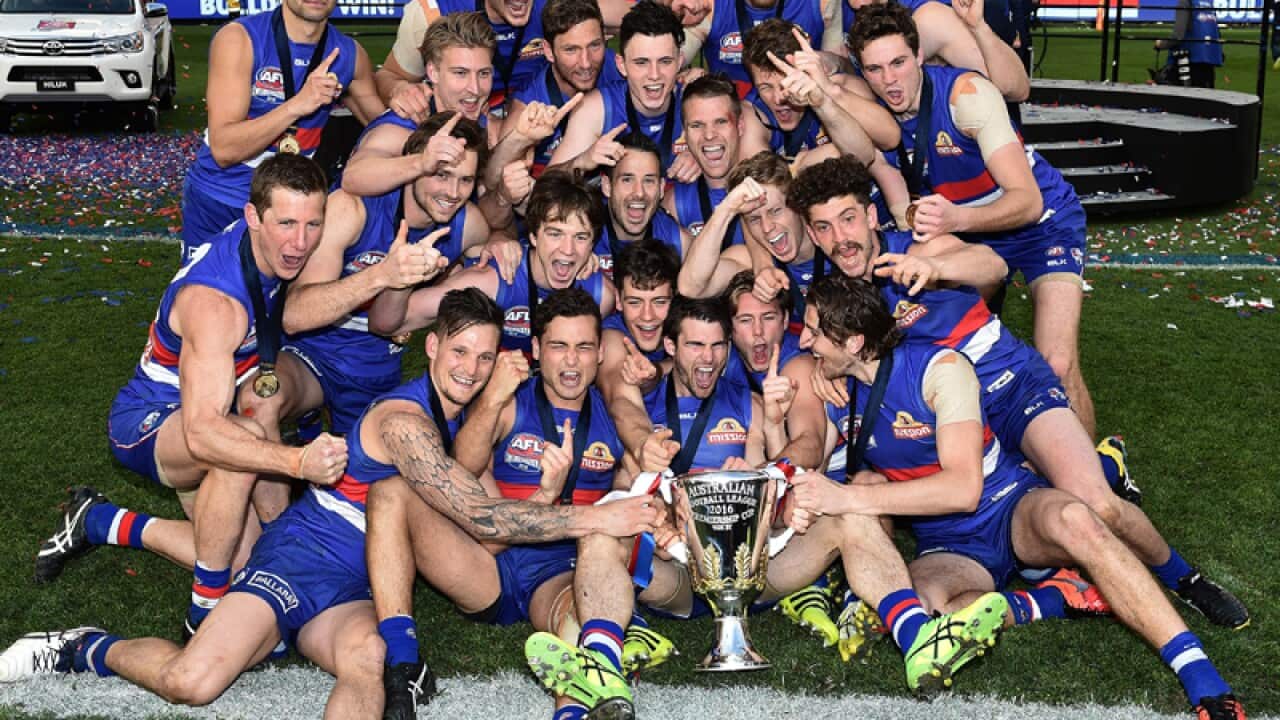 Western Bulldogs players with the AFL premiership trophy