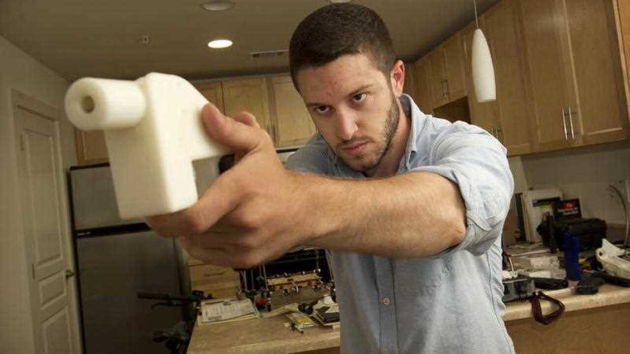 Cody Wilson shows off the first completely 3D-printed handgun, The Liberator.