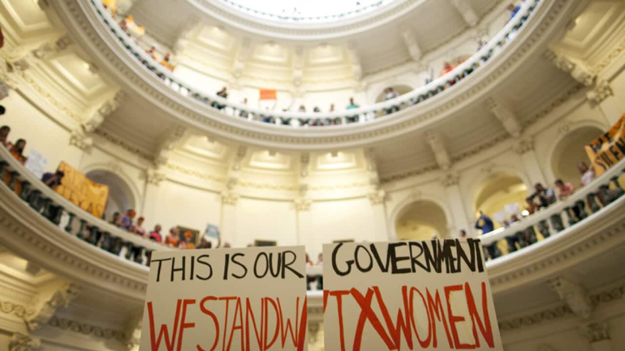 Abortion rights supporters rally in the State Capitol in Texas