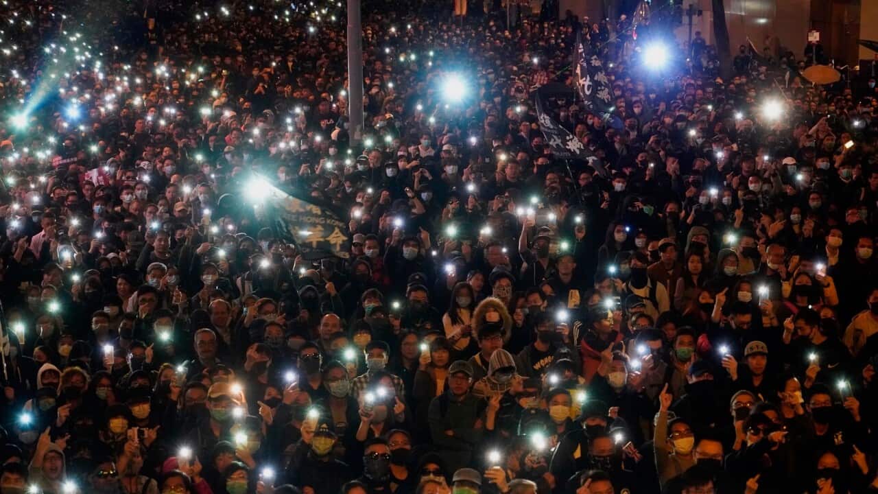 Pro-democracy protesters gather on a street in Hong Kong