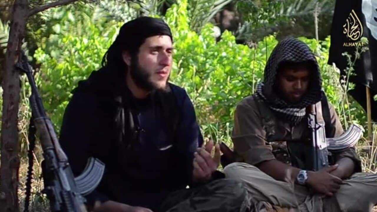 The YouTube clip shows apparent British and Australian Jihadist militants discussing why they joined the fight. SBS cannot verify the video. (Screenshot: SBS)