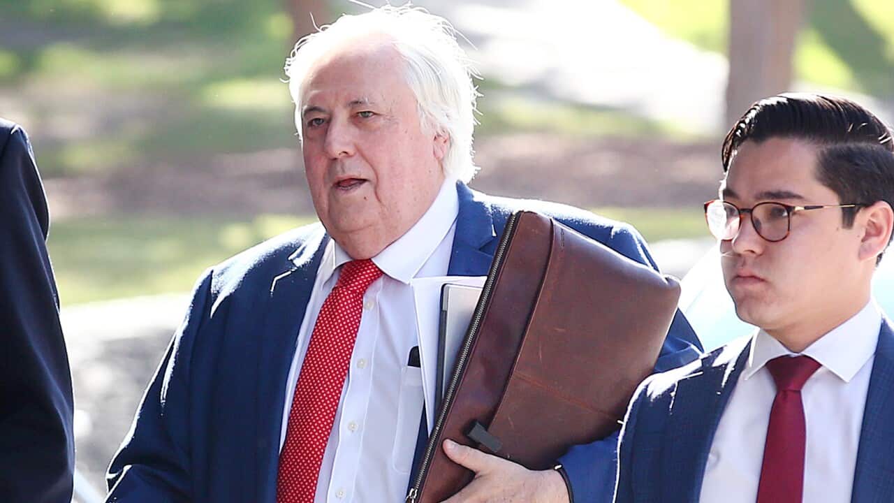 Businessman Clive Palmer arrives to the District Court in Brisbane, Thursday, July 25, 2019. Liquidators are trying to claw back $200 million in claims owed by Mr Palmer over the collapse of Queensland Nickel. (AAP Image/Jono Searle)