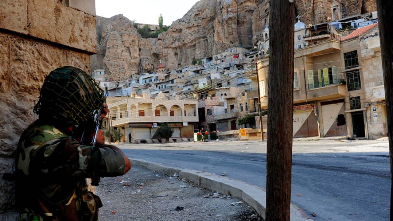 A Syrian soldier during a patrol in the Christian town of Maalula