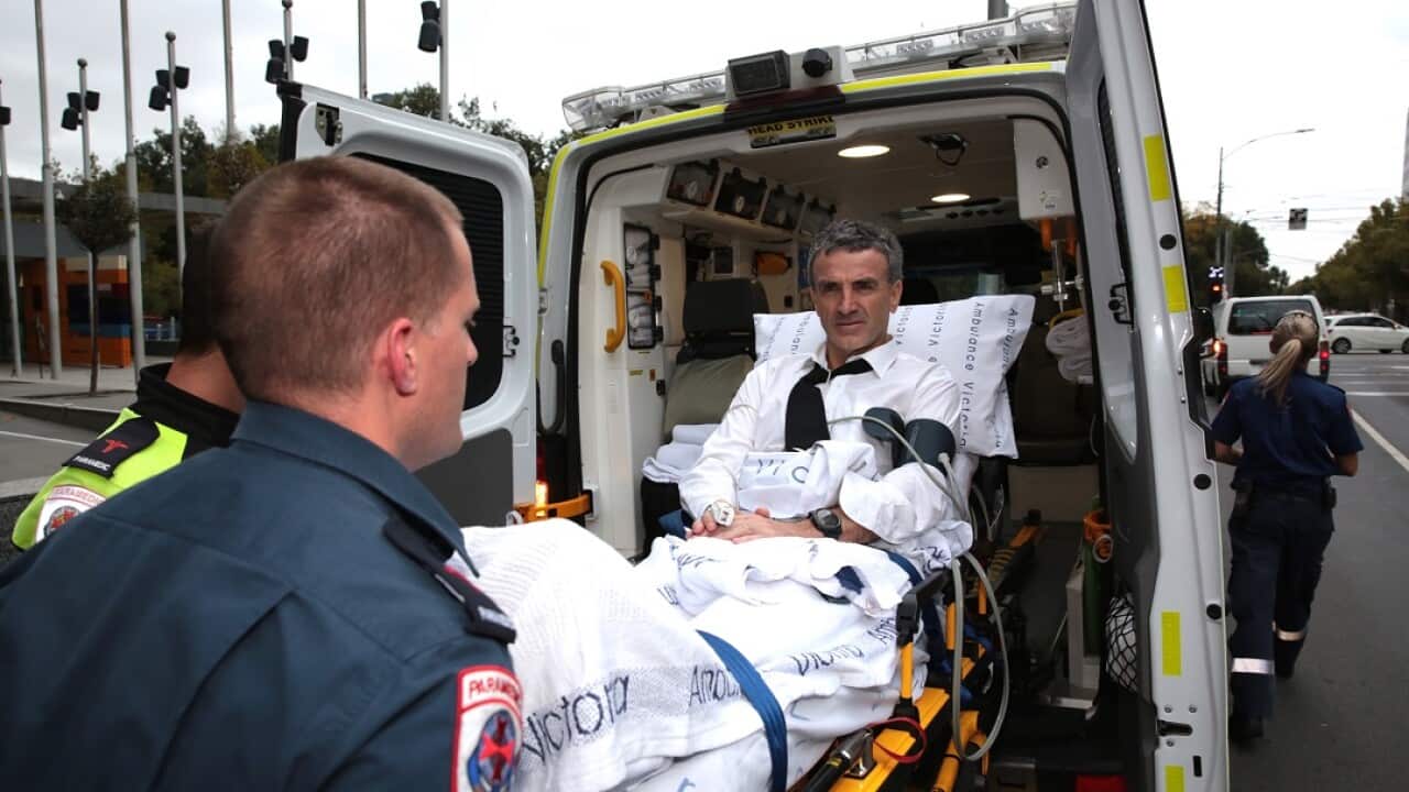 Dover owner Terry McMaster leaves the Federal Court with the aid of paramedics after collapsing at the banking royal commission.