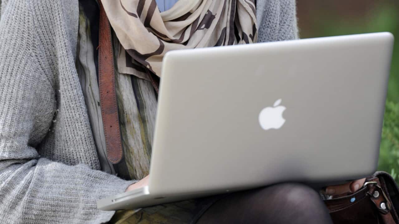 A university student uses a laptop