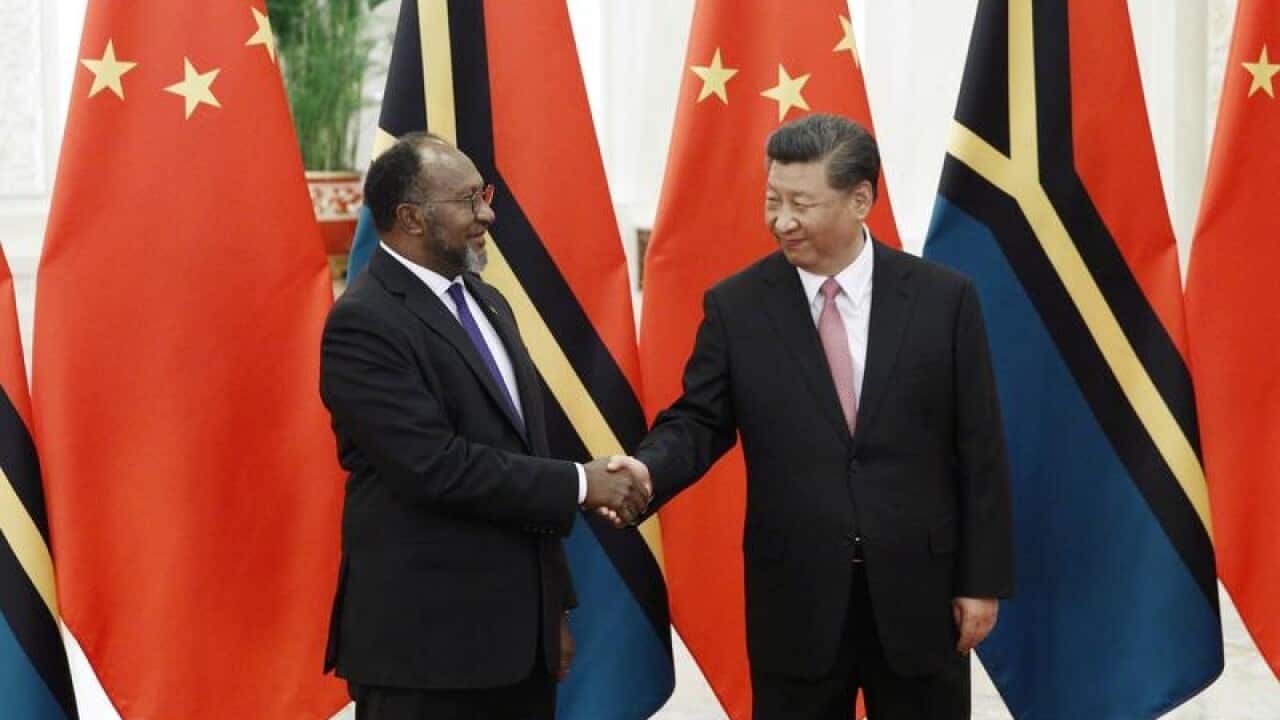 Vanuatu's Charlot Salwai (L) and China's Xi Jinping (R)