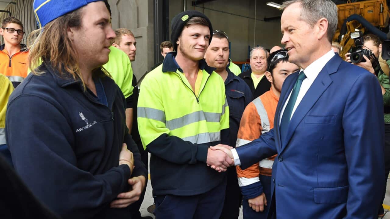 Opposition Leader Bill Shorten speaks with apprentices