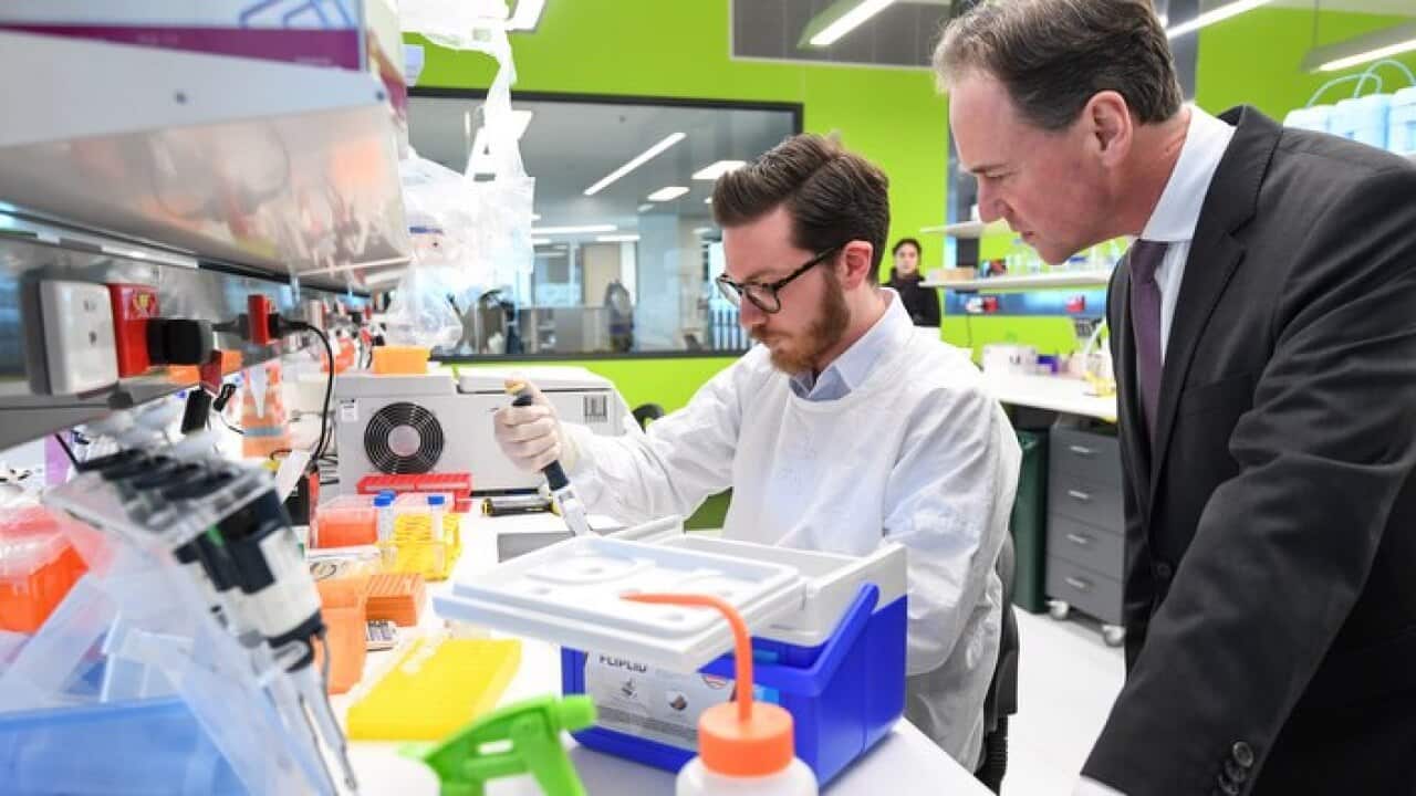 Federal Minister for Health Greg Hunt visits a research laboratory at the Peter Mac Cancer Centre in Melbourne