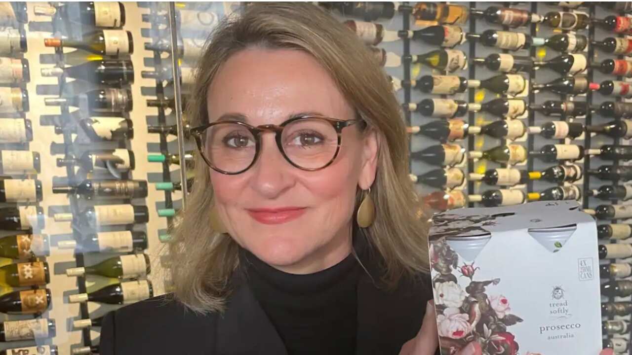 Denomination CEO and co-founder Rowena Curlewis holding a box of canned wine