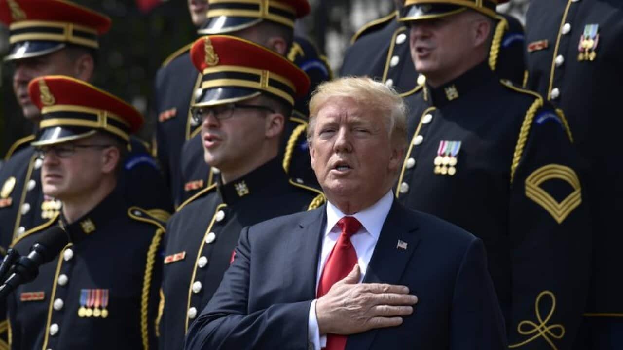 President Donald Trump sings the National Anthem during a "Celebration of America" event at the White House, Tuesday, June 5.